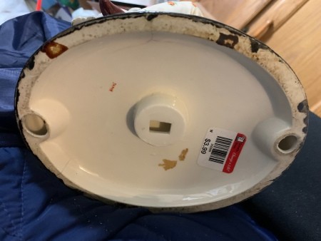 The bottom of a figurine.