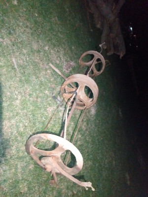 A long metal item on the grass.