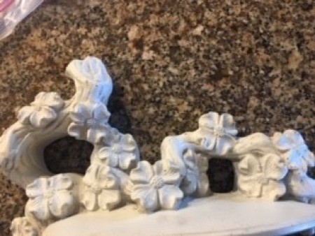 The unpainted flower shelf.