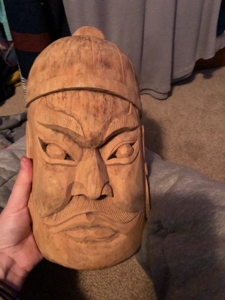 A wooden face mask.