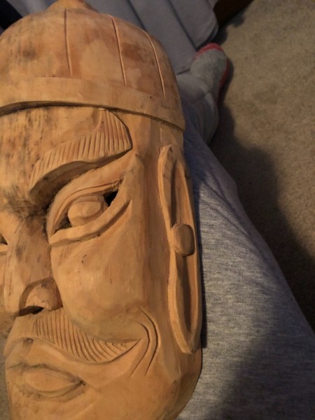 A wooden face mask.