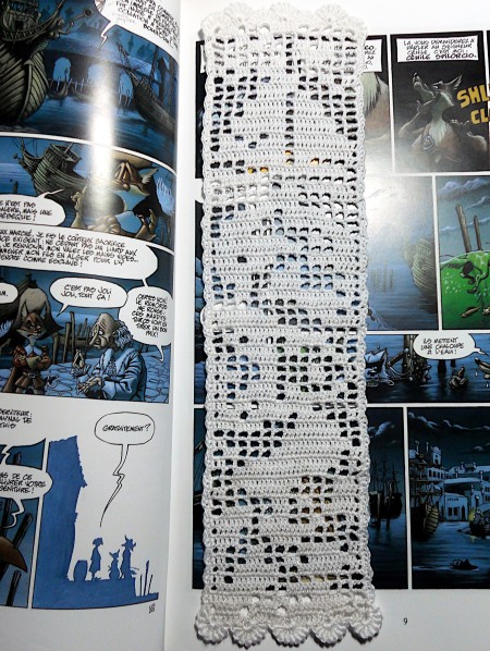 The completed bookmark in a book.