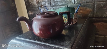 A ceramic pot with a lid.