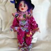 A colorful clown porcelain doll.