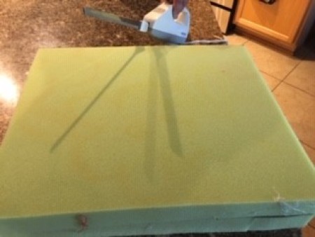 Cutting foam to size.