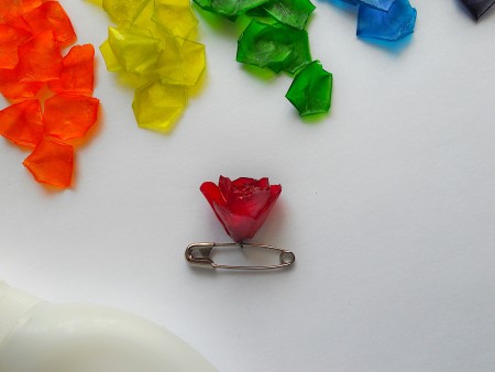 Using the safety pin to make a flower from the scales.