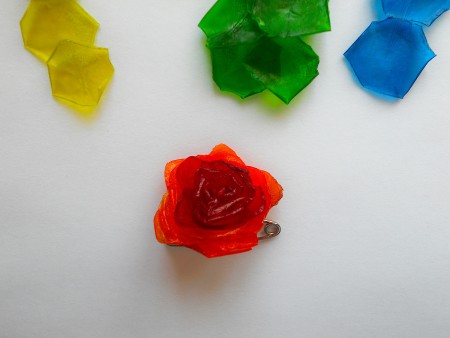 Using the safety pin to make a flower from the scales.