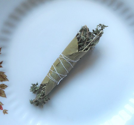 A bouquet garni wrapped up with kitchen twine.