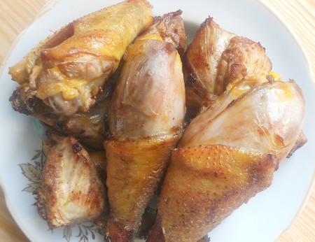 The browned chicken pieces on a plate.