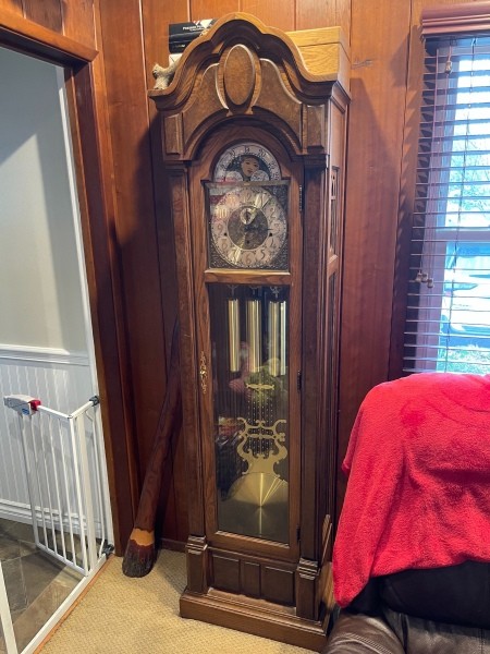 A grandfather clock in a living room.