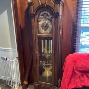 A grandfather clock in a living room.