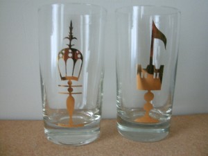 Drinking glasses with gold emblems.