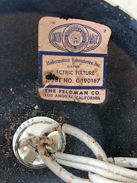 The marking on an old chandelier.