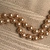 A strand of golden pearls.