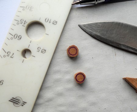 Cutting circles out of the cork.