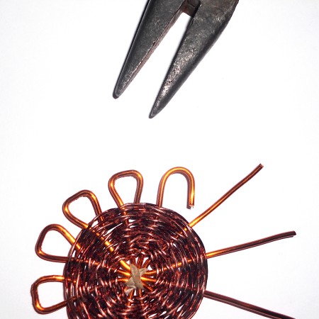 Bending the ends of the wire in a loop.