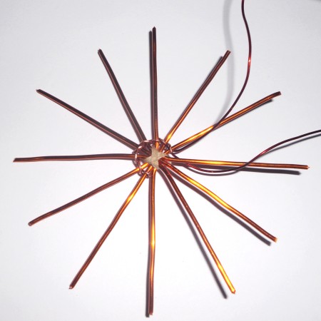 Starting to weave the copper wire.