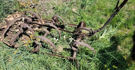 A old piece of farm equipment.