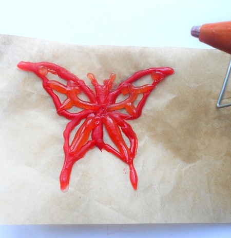A butterfly drawn from hot glue.