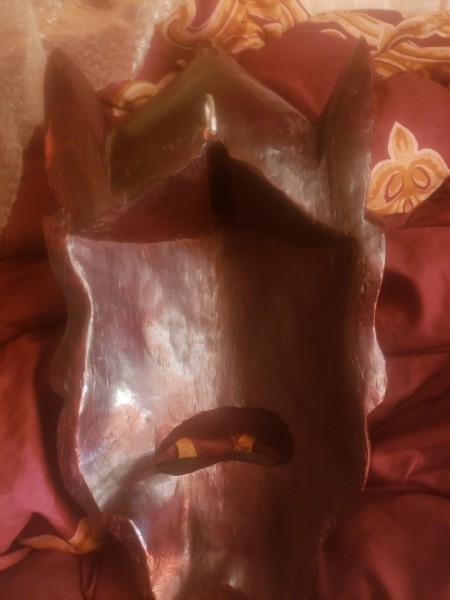 The back of a wooden mask.