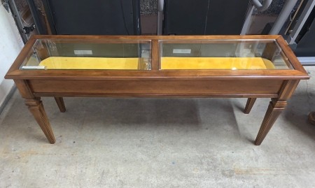 A Brandt display top table with yellow fabric inside.