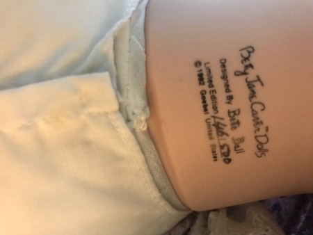 The marking on the back of a porcelain doll's neck.