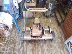 An old gas powered Yardman reel mower.