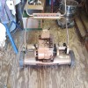 An old gas powered Yardman reel mower.