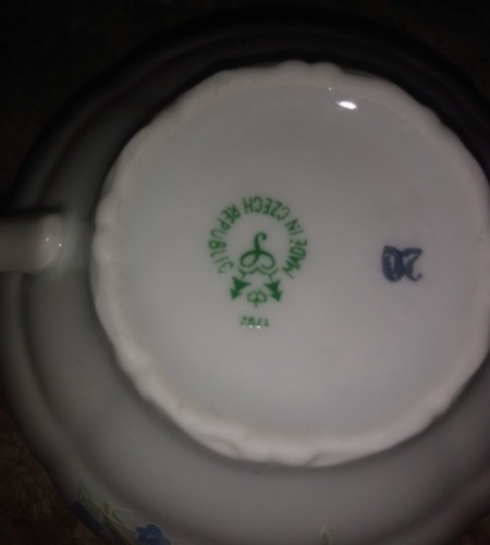 A marking on the bottom of a china cup.