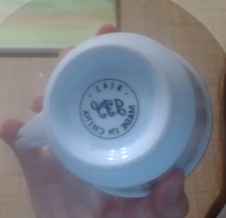 A mark on the bottom of a china cup.