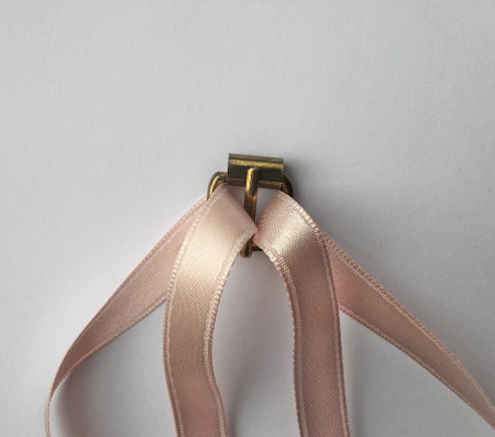 Looping ribbon pieces through an old belt.