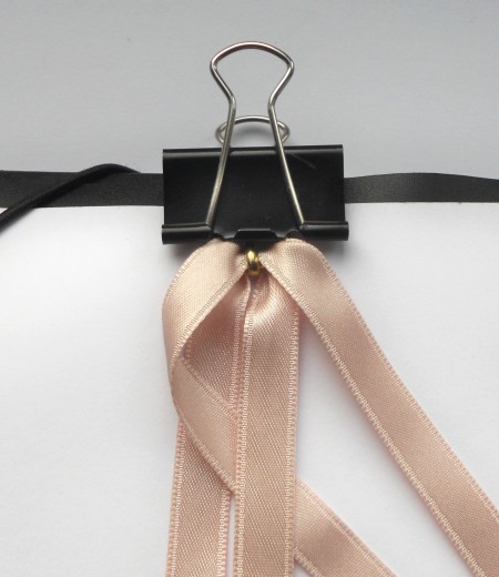 Holding the ribbons with a binder clip while braiding.