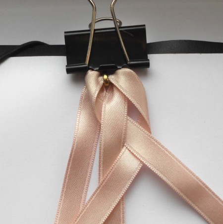 Holding the ribbons with a binder clip while braiding.