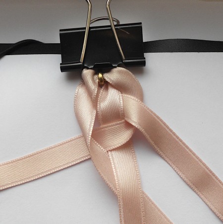 Holding the ribbons with a binder clip while braiding.