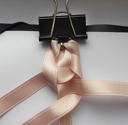 Holding the ribbons with a binder clip while braiding.