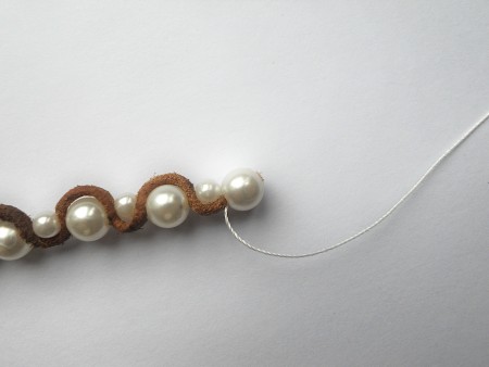Finishing the end of the bracelet.