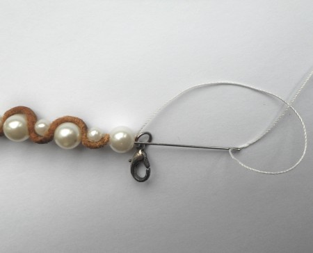 Finishing the end of the bracelet.