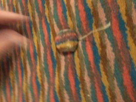 Attaching the buttons to the fabric.