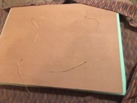 Attaching the buttons to the fabric.