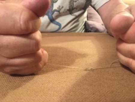 Attaching the buttons to the fabric.