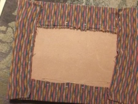 attaching the fabric to the top.