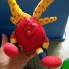 A brightly colored stuffed toy.