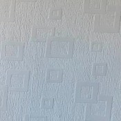 A white wallpaper with geometric designs.