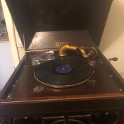 An open old Carsonola crank phonograph.