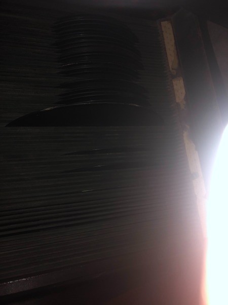 A record being inserted into a phonograph.