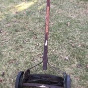 An old rusty reel mower.