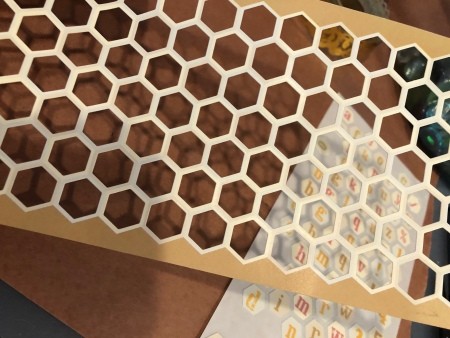 Paper with honeycomb patterned holes.