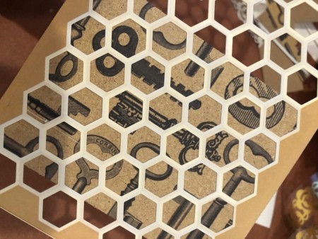 Placing the honeycomb paper over the decorative paper.