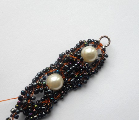 continue, adding second mother of pearl bead
