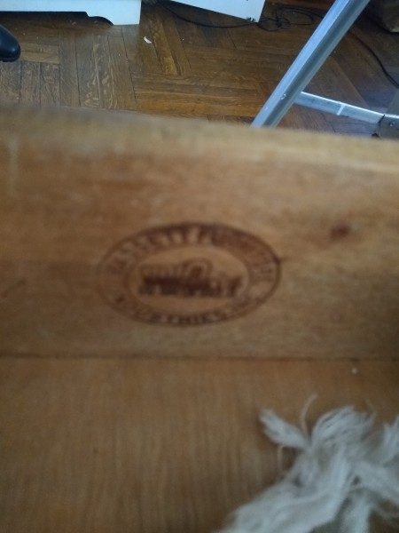 A manufacturer's marking on a dresser.